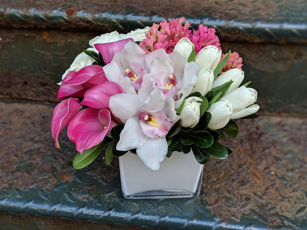 pink Calla Lilies, white Cymbidium Orchids, pink fragrant Hyacinth, and white Tulips