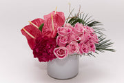 dozen Bubble gum roses, pink hydrangea and cotton candy anthurium designed in a white glass cylinder
