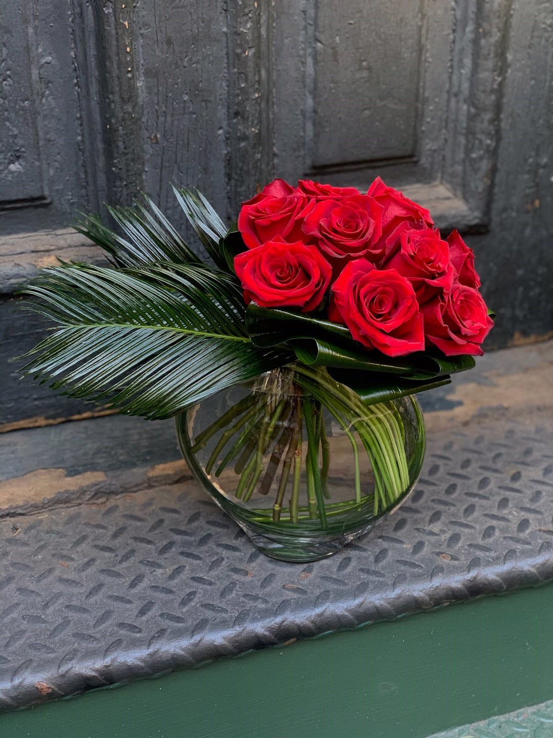 dozen roses in vase