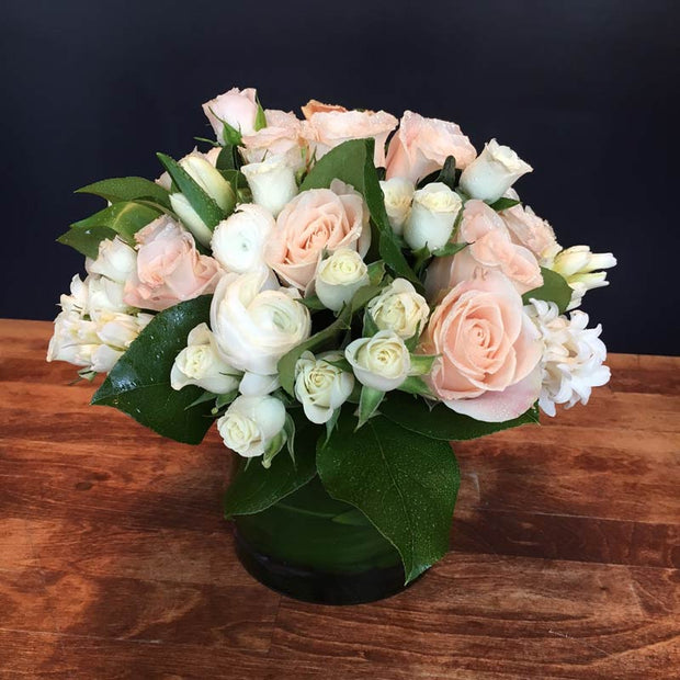 Peach Roses, White Ranunculus, White Spray Rose, White Hyacinth, and White Tulips