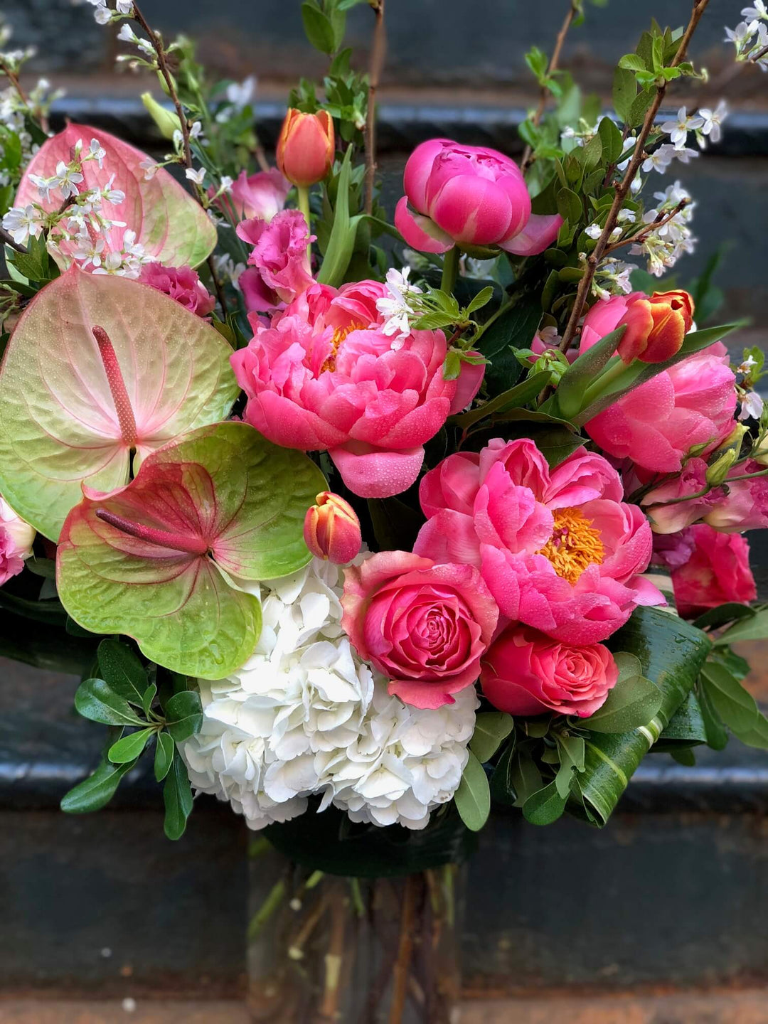 arrangement of Peony, Hydrangea, Lisianthus, Anthurium, Roses, and Tulips