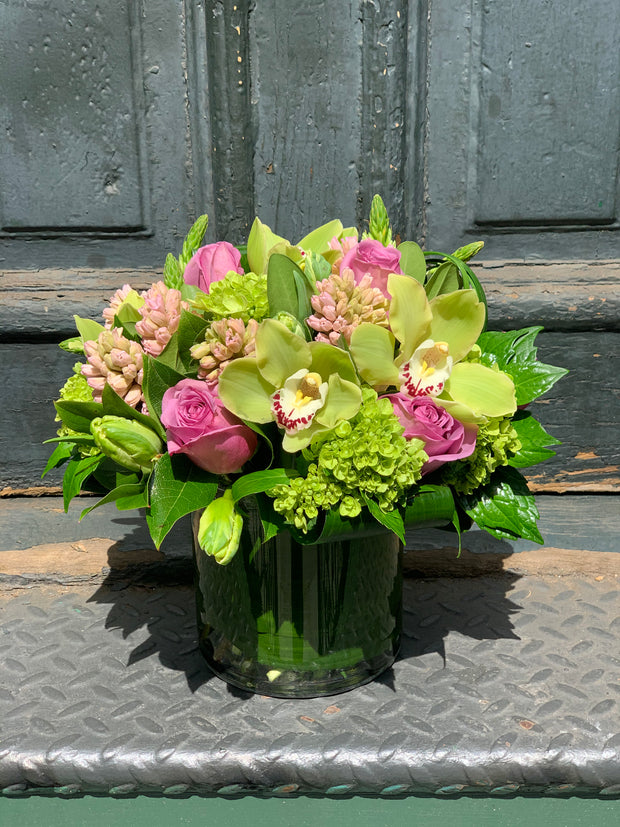 Kiwi green hydrangea, orchids, soft scent hyacinth, lavender roses, green or white tulips.