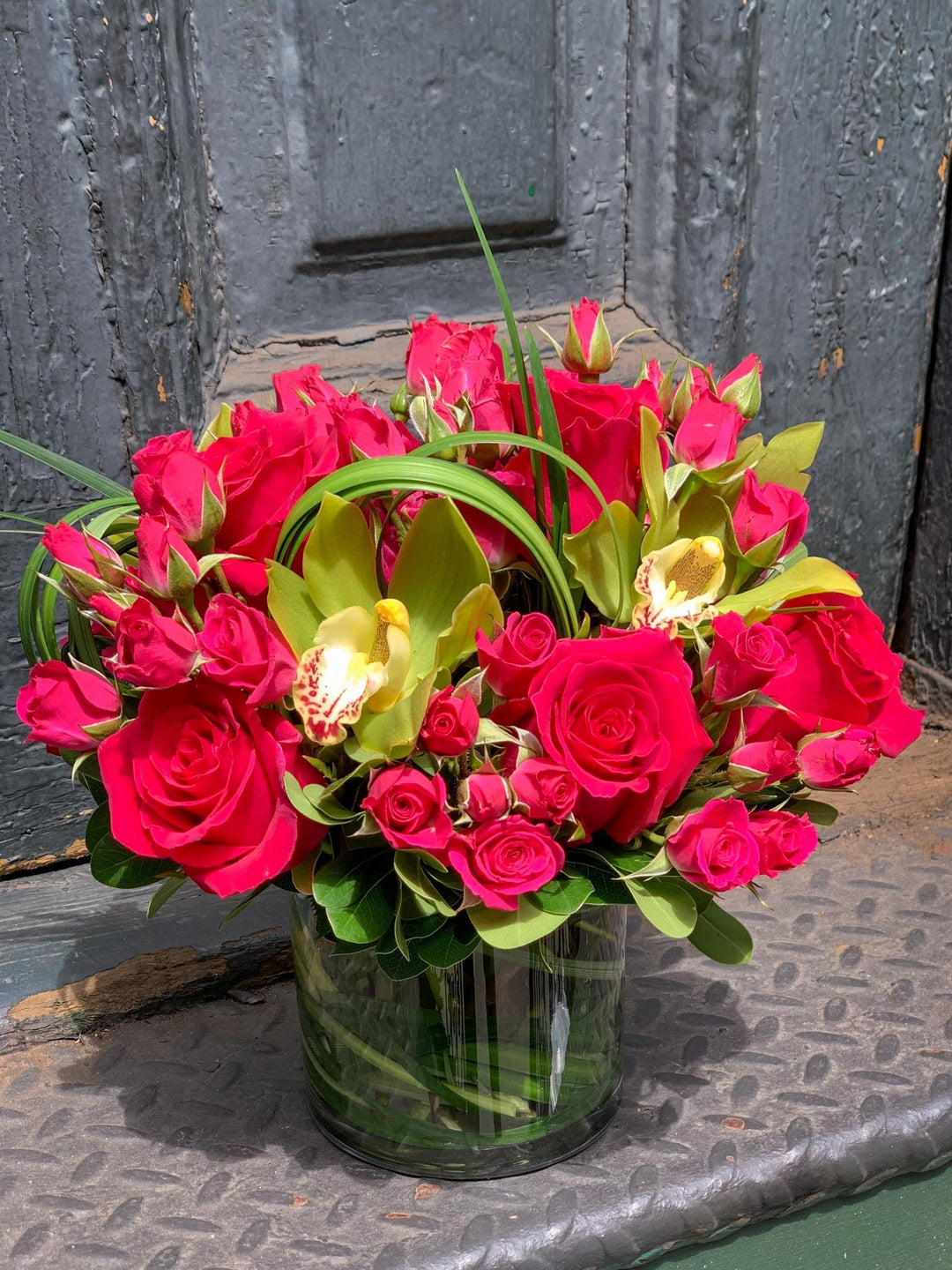 variations of roses, orchids, spray rose, and modern accents of lily grass or aspidistra