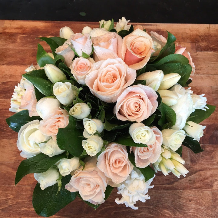 Peach Roses, White Ranunculus, White Spray Rose, White Hyacinth, and White Tulips