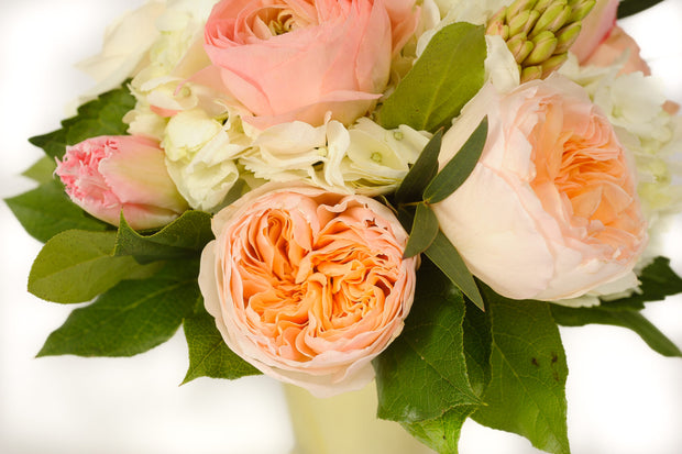 pure white hydrangea, peach fragrant garden roses, fragrant blush hyacinth, and pink confetti tulips