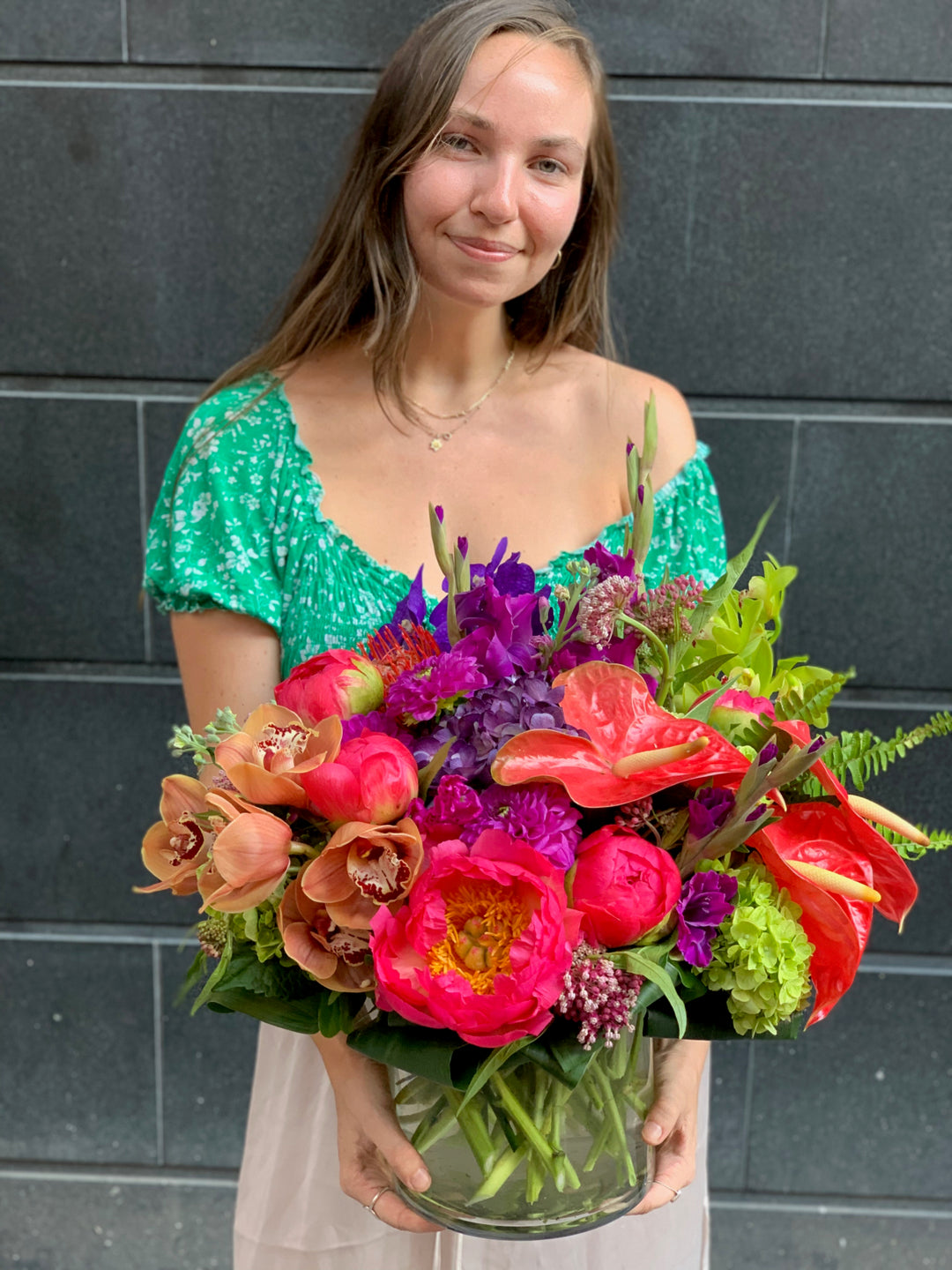 orchids, anthirium, Dahlia, Peony, Stock, Snap Dragon, and Gladiolus flower arrangement