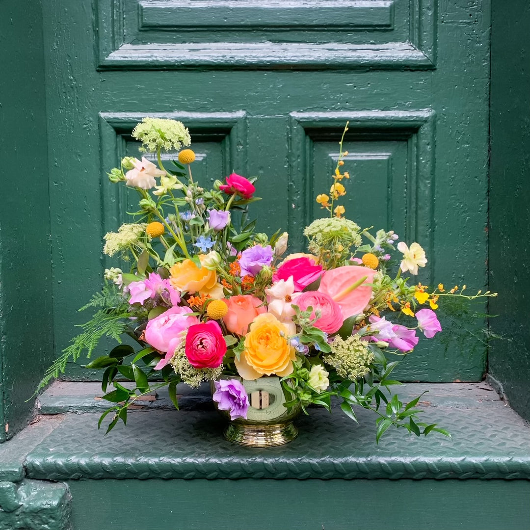 pastel garden flowers with hints of yellow and lavender, pops of pink, and accents of bright hot pink