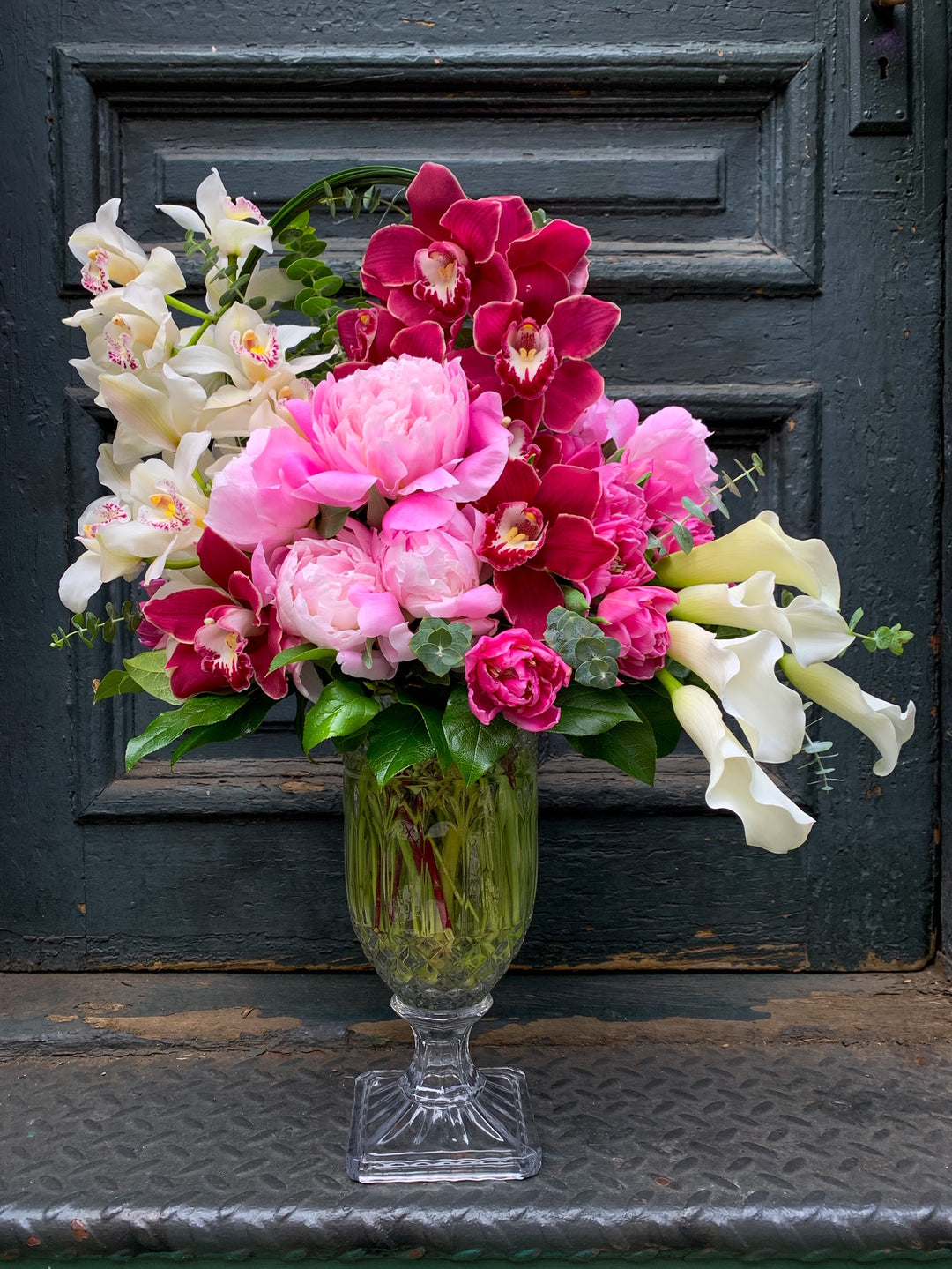 Tall stately peony, orchid, rose, and Calla Lilly design